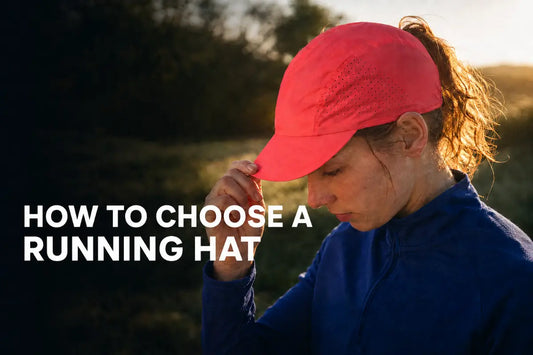 Woman adjusting a lightweight perforated running hat before a sunrise run