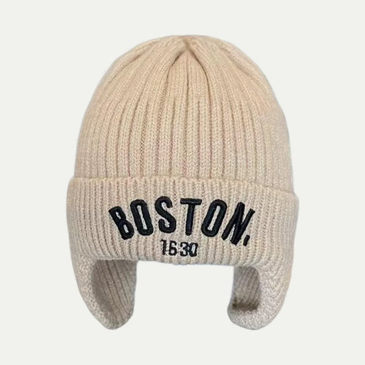 beige earflap beanie with rib knit texture and front logo
