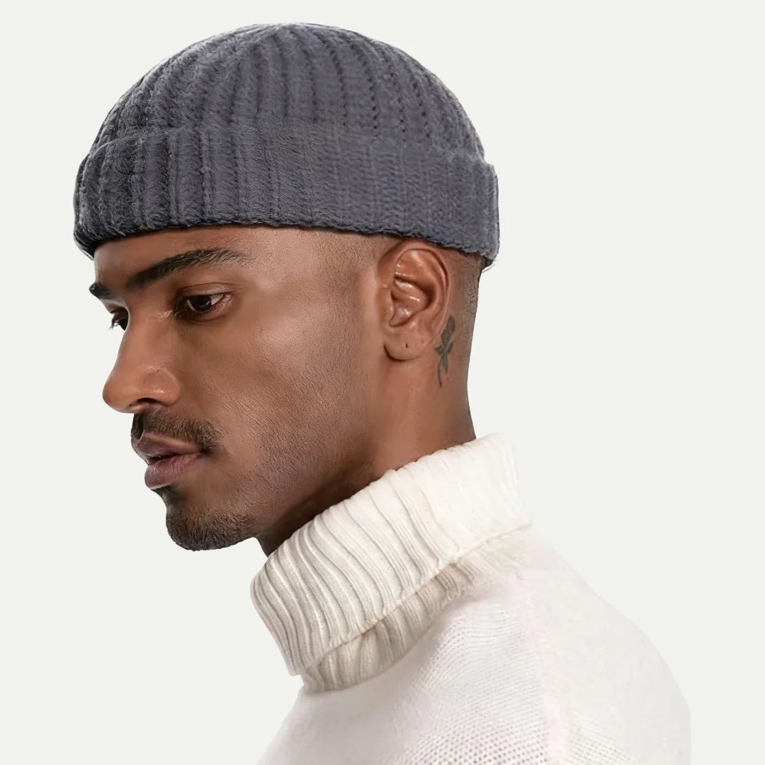 man wearing gray short fisherman ribbed beanie with folded cuff