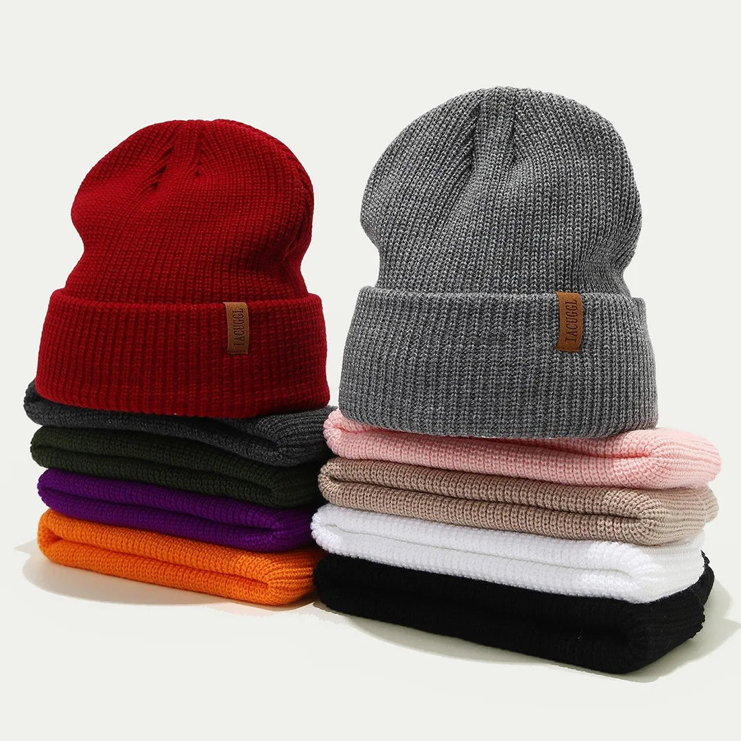 ribbed knit cuffed beanies stacked in multiple colors with folded cuffs