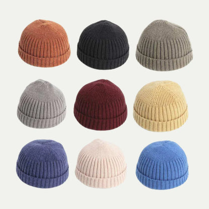 short ribbed fisherman beanies arranged in multiple solid colors on white background