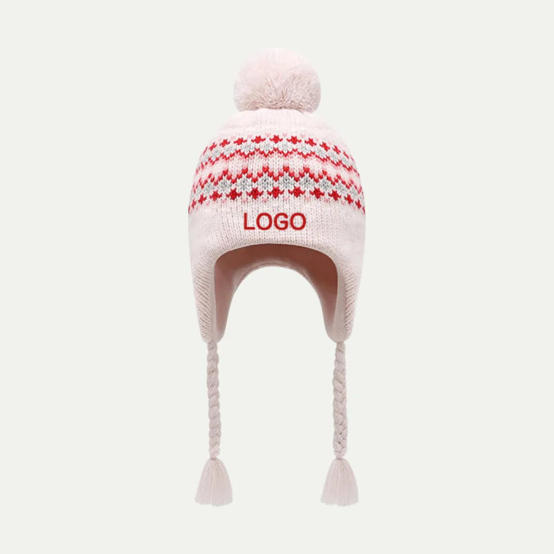 pink knit earflap beanie with pom and braided tassels