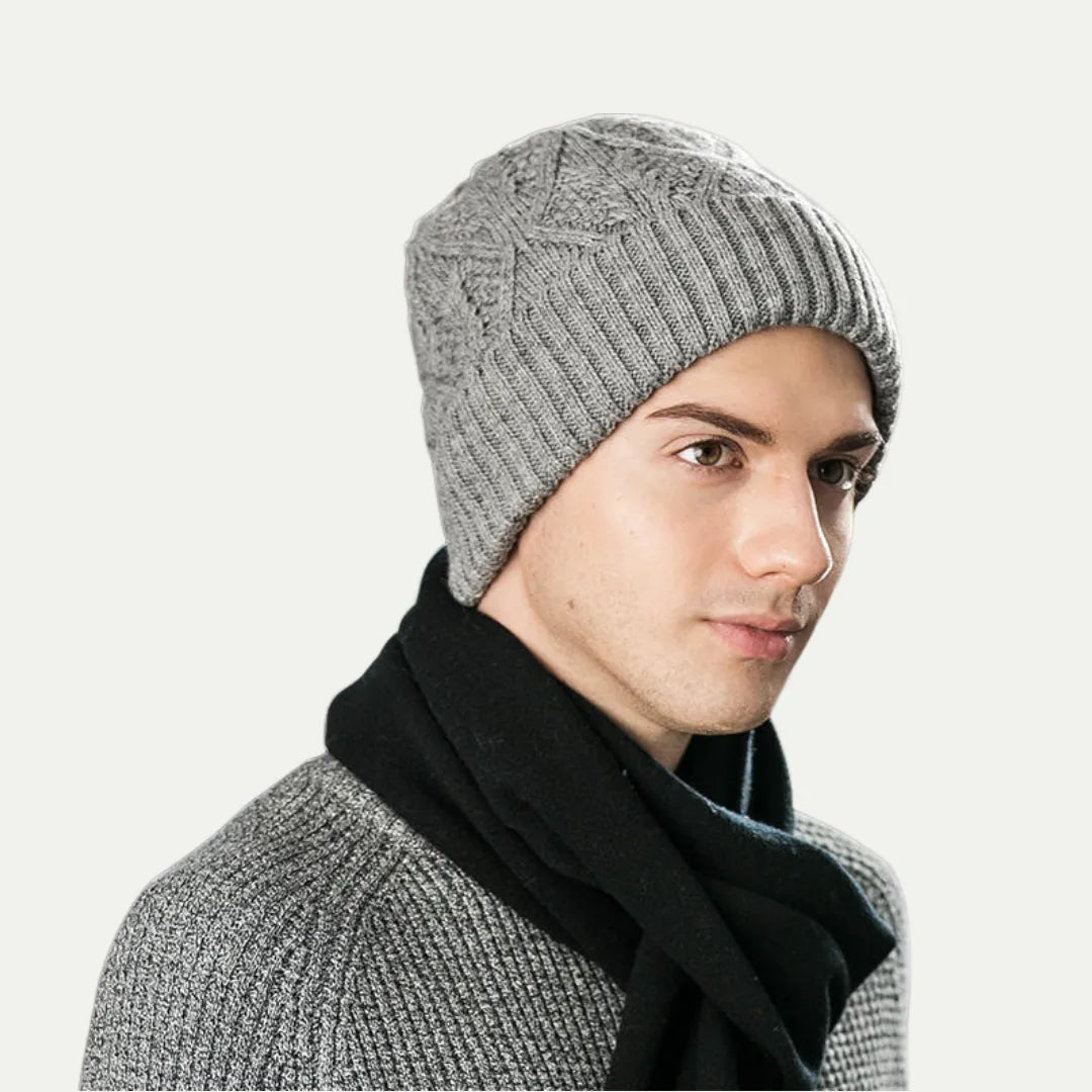 person wearing gray ribbed knit beanie with folded cuff in side profile