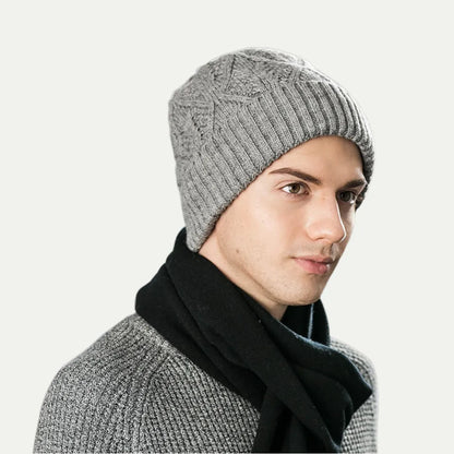 person wearing gray ribbed knit beanie with folded cuff in side profile