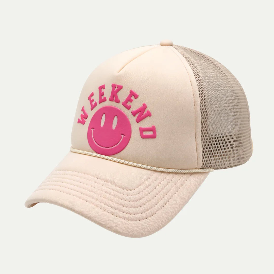 cream custom puff print mesh trucker hat angled front view with pink logo