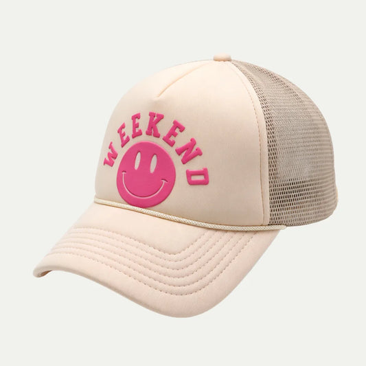 cream custom puff print mesh trucker hat angled front view with pink logo