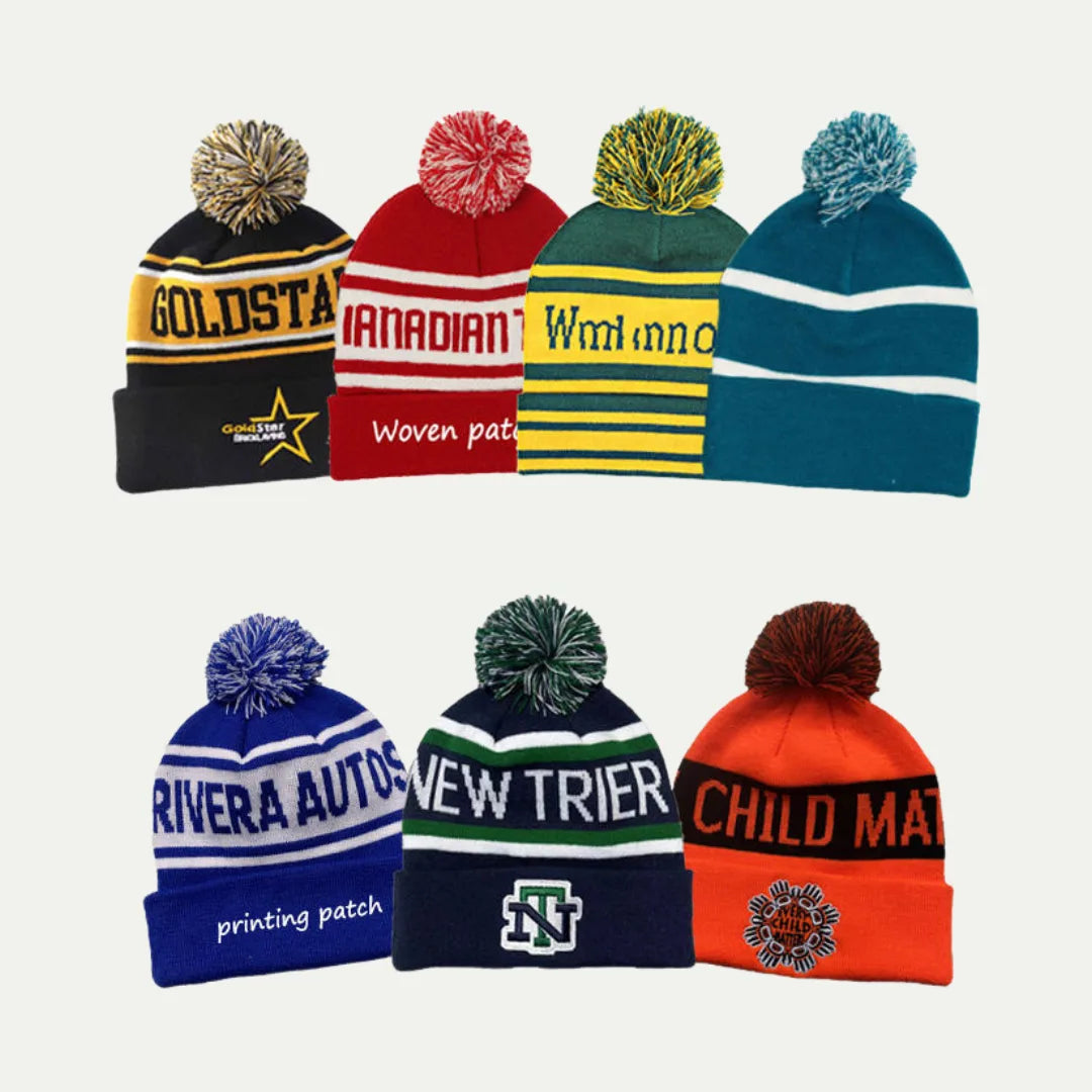 set of striped pom pom cuffed beanies in different colors
