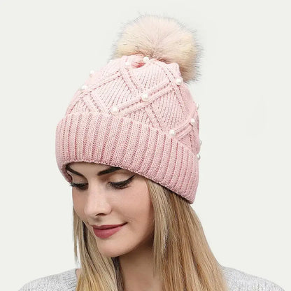 woman wearing pink pearl pom beanie